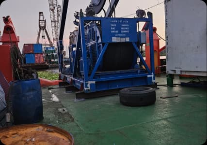 Professional diving team performing underwater hull cleaning service